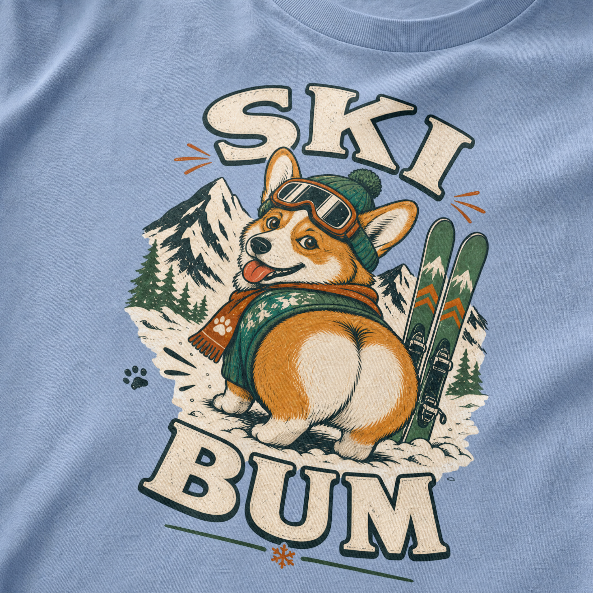 T-shirt with a corgi graphic and 'Ski Bum' text on a washed denim blue background