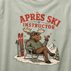 T-shirt with a moose graphic and 'Après Ski Instructor' text on a bay green background