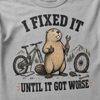 Graphite gray t-shirt with a beaver holding a wrench and text 'I Fixed It Until It Got Worse' on a mountain bike graphic.