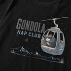Black t-shirt featuring a cat napping in a ski gondola with text, "Gondola Nap Club".