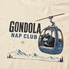 Ivory white t-shirt featuring a cat napping in a ski gondola with text, "Gondola Nap Club".