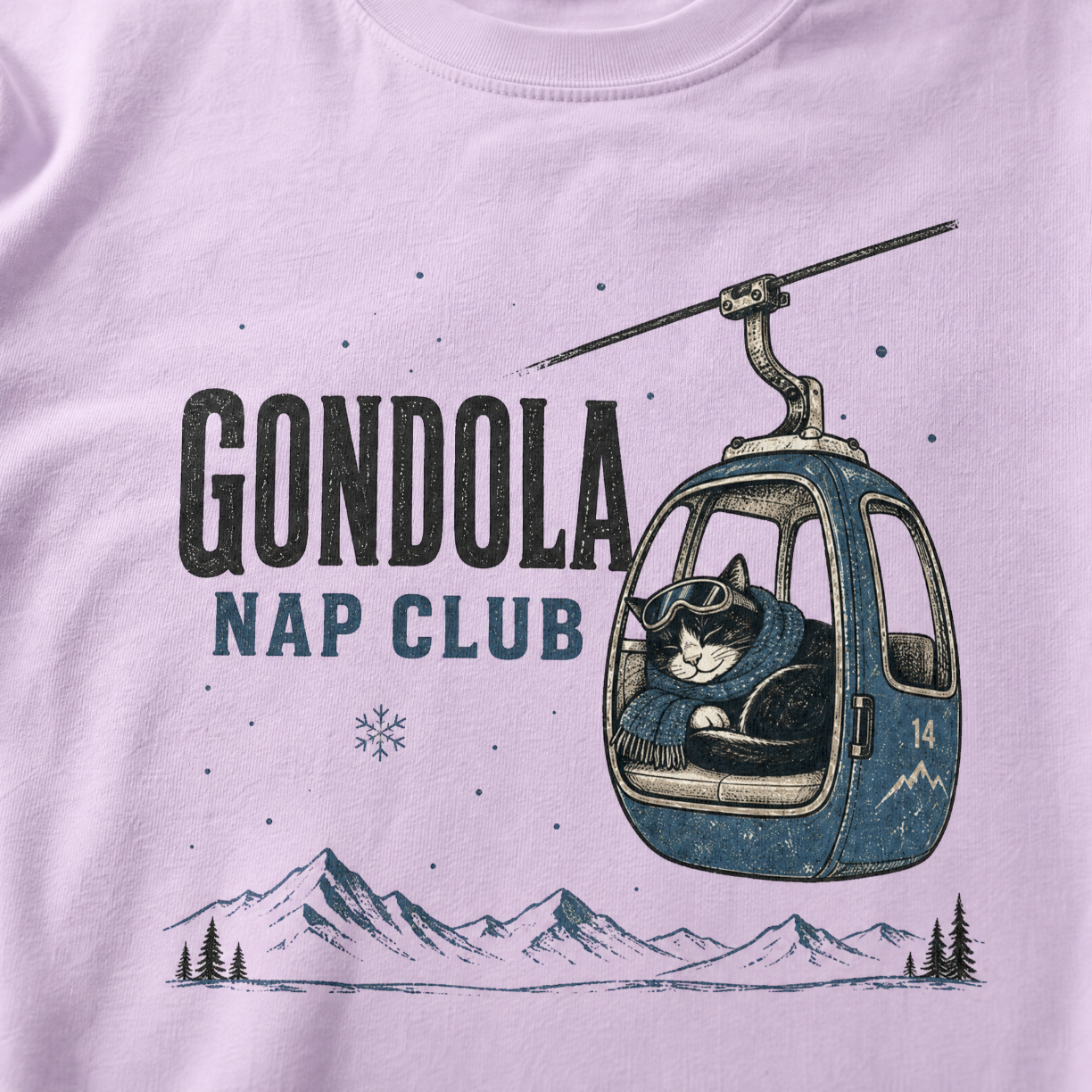 Orchid colored t-shirt featuring a cat napping in a ski gondola with text, "Gondola Nap Club".