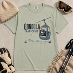 Bay green t-shirt featuring a cat napping in a ski gondola with text, "Gondola Nap Club".
