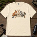 Flat lay of an ivory white t-shirt featuring a cute woodland animal trail-planning graphic with a fox, rabbit, raccoon, map, helmet, bike, and trail marker.