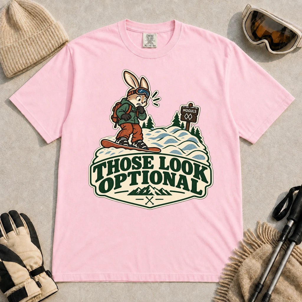 Blossom tee featuring a cautious bunny snowboarder facing a mogul run beside a “Moguls” sign above the phrase “Those Look Optional.”
