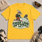 Daisy tee featuring a cautious bunny snowboarder facing a mogul run beside a “Moguls” sign above the phrase “Those Look Optional.”