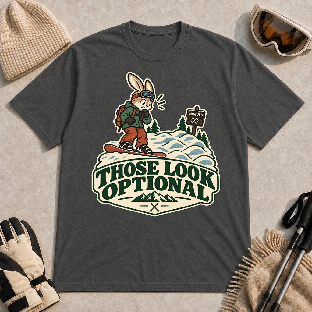 Dark Heather Gray tee featuring a cautious bunny snowboarder facing a mogul run beside a “Moguls” sign above the phrase “Those Look Optional.”