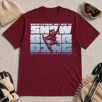 Maroon tee featuring a raccoon snowboarding through bold blue typography, with the phrases “Winter Is Coming and I Must Go” and “Flying Is Hard but Landing Is Harder.”