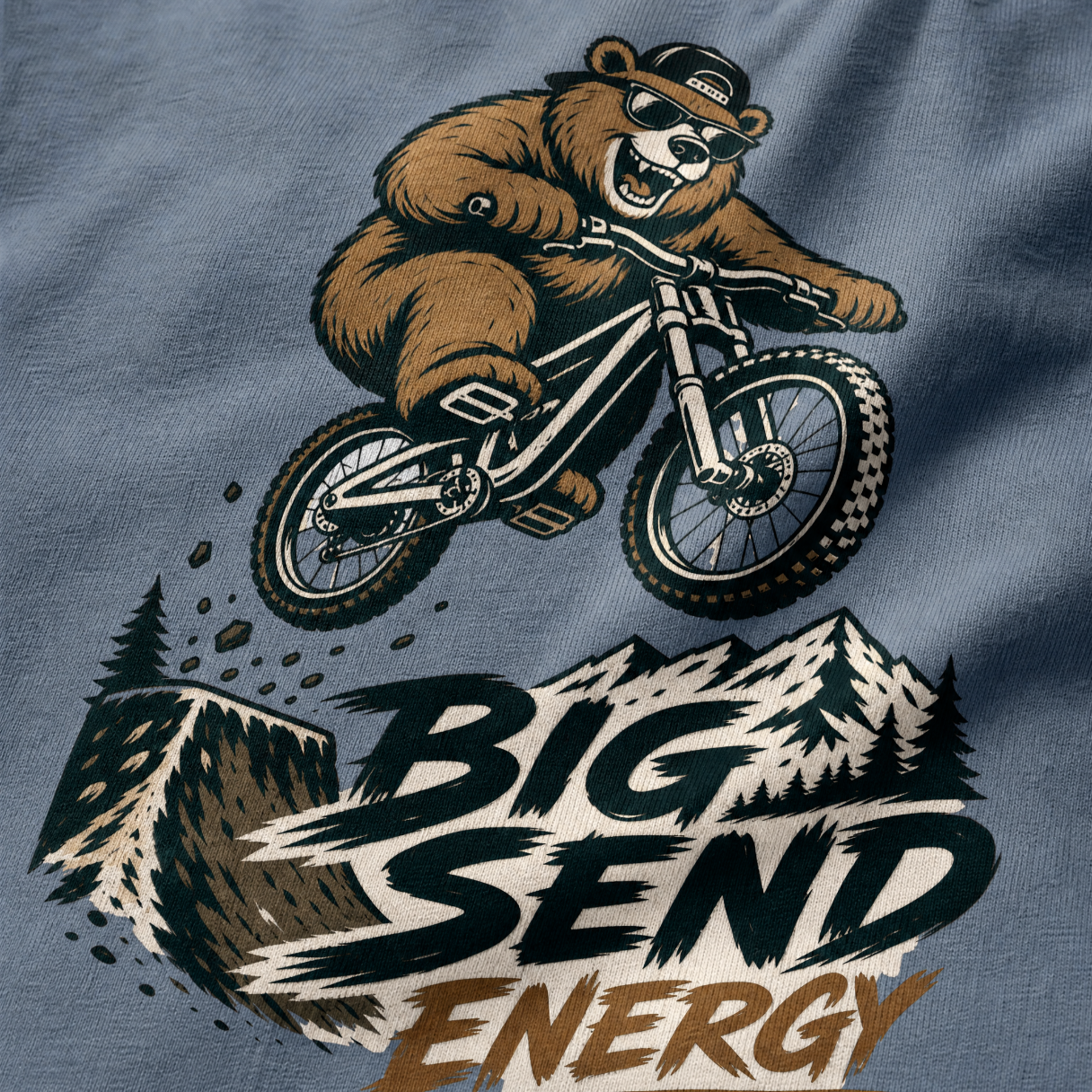 T-shirt with a bear riding a bike and 'Big Send Energy' text on a blue jean background
