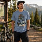 Man wearing a t-shirt with a bear graphic and 'Big Send Energy' text, standing outdoors with a mountain background.