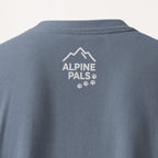 Blue jean colored shirt with 'Alpine Pals' logo on a white background