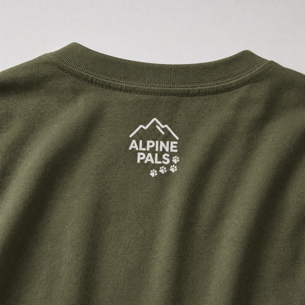 Green sweatshirt with 'Alpine Pals' logo on a white background