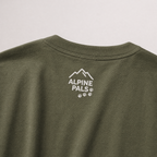 Green shirt with 'Alpine Pals' logo on a light gray background
