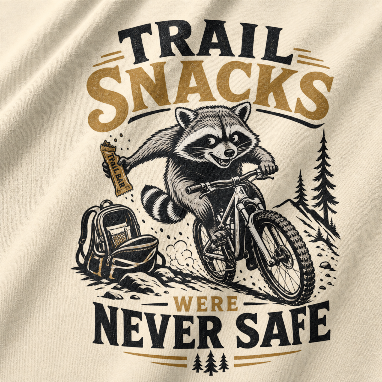 T-shirt design with a raccoon on a bike, backpack, and text 'Trail snacks were never safe' on beige fabric.