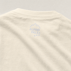 Beige fabric with 'Alpine Pals' logo on a gray background