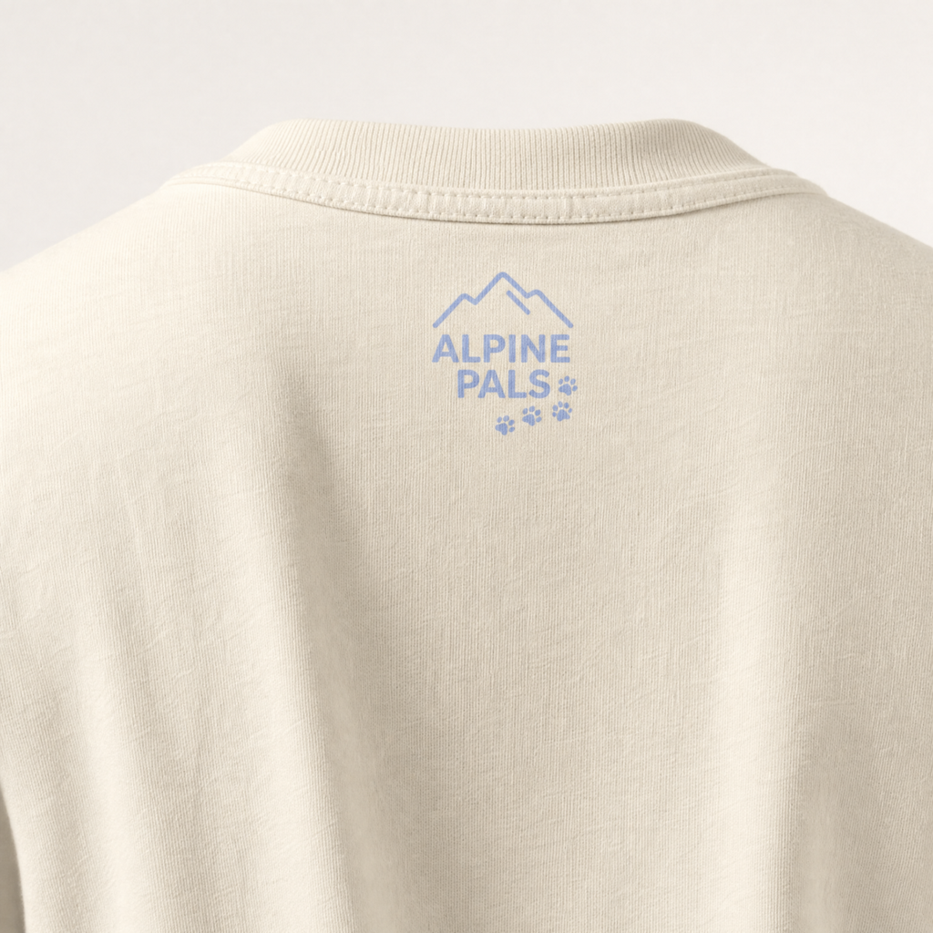 Ivory shirt with 'Alpine Pals' logo on a light gray background