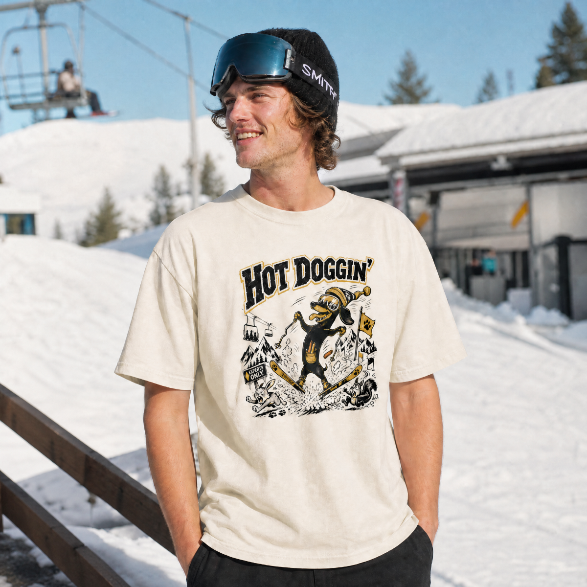 Person wearing a 'Hot Doggin' t-shirt with a snowy background
