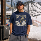 Person wearing a navy blue t-shirt with 'Hot Doggin' graphic design in an outdoor setting.