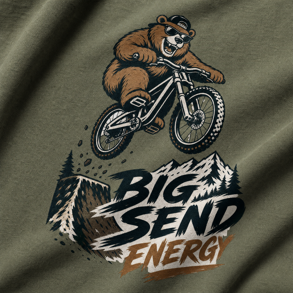 T-shirt with a bear riding a bike and 'Big Send Energy' text on a green background