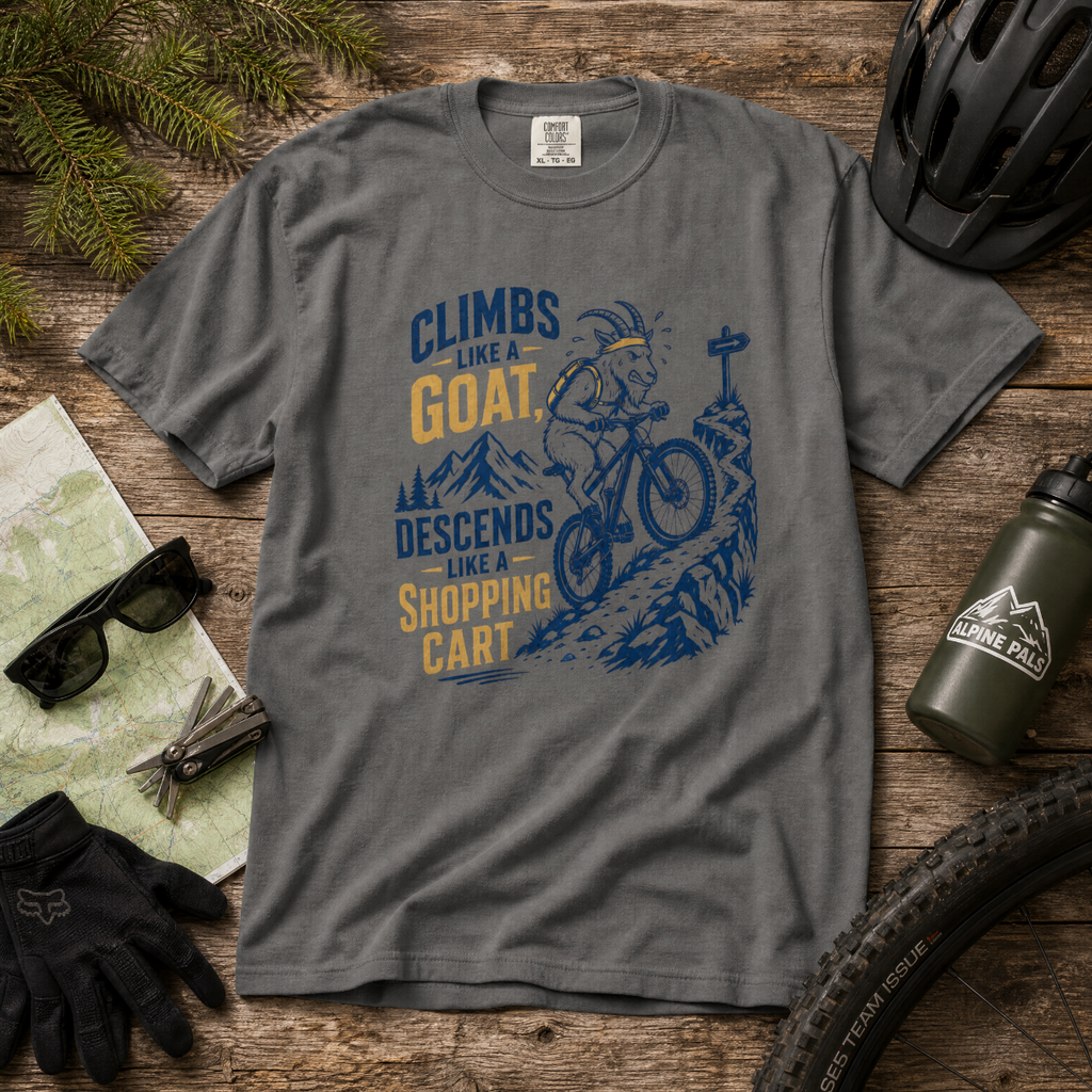 Pepper colored t-shirt with a graphic design on a wooden surface with cycling accessories.