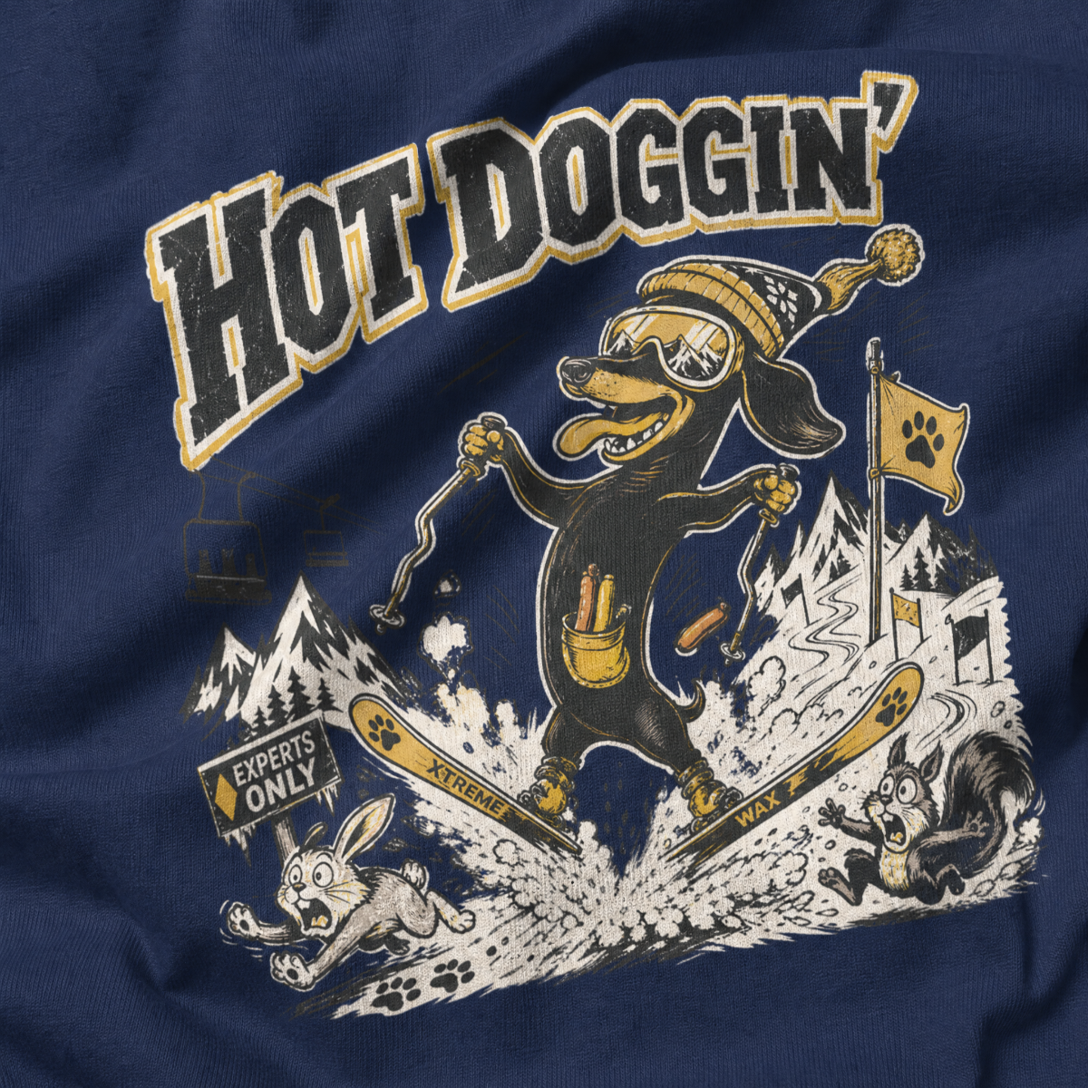 Navy blue t-shirt with a cartoon dog skiing and text 'Hot Doggin'' on a mountainous background.