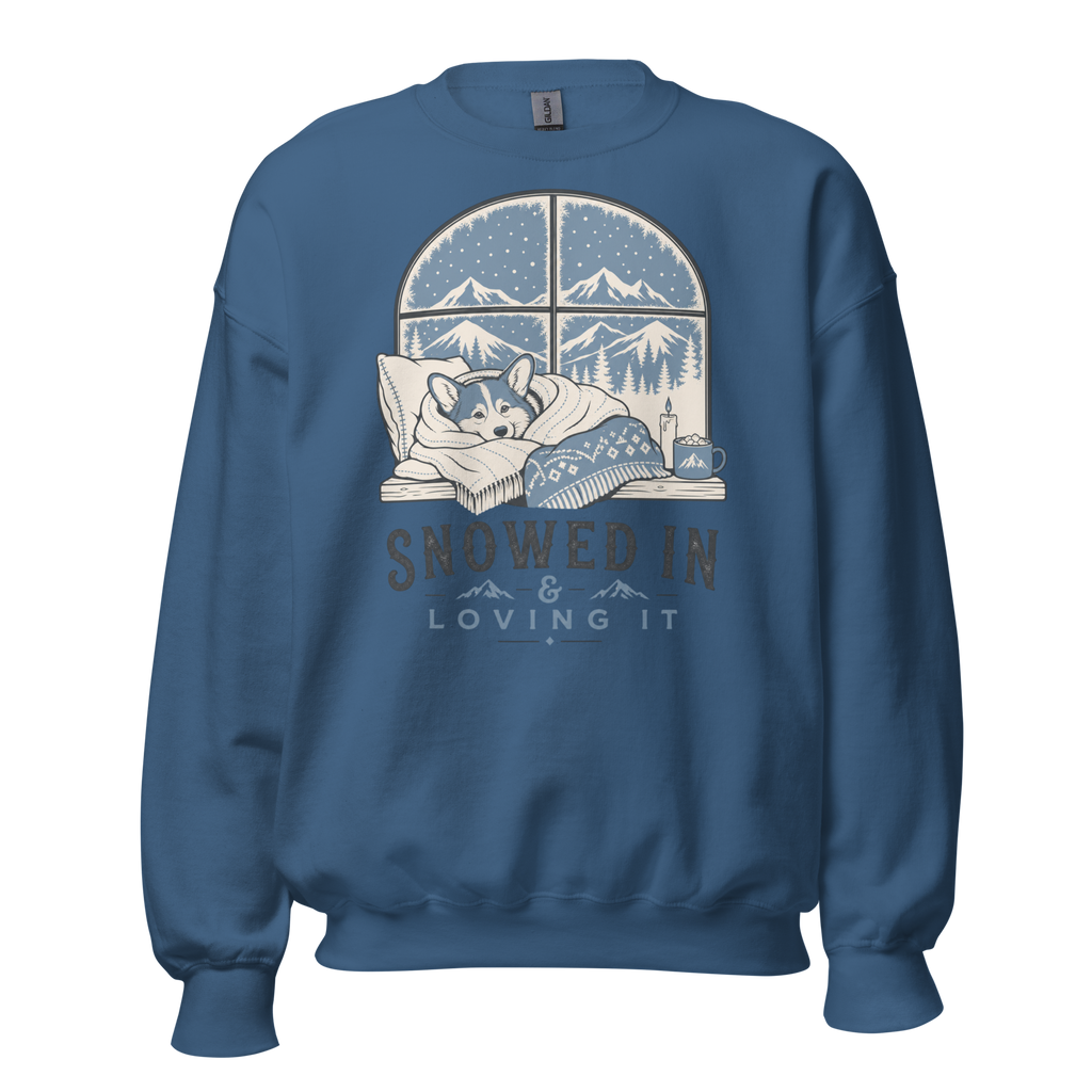 Indigo blue sweatshirt with a graphic of a dog by a window and 'Snowed In & Loving It' text on a white background.