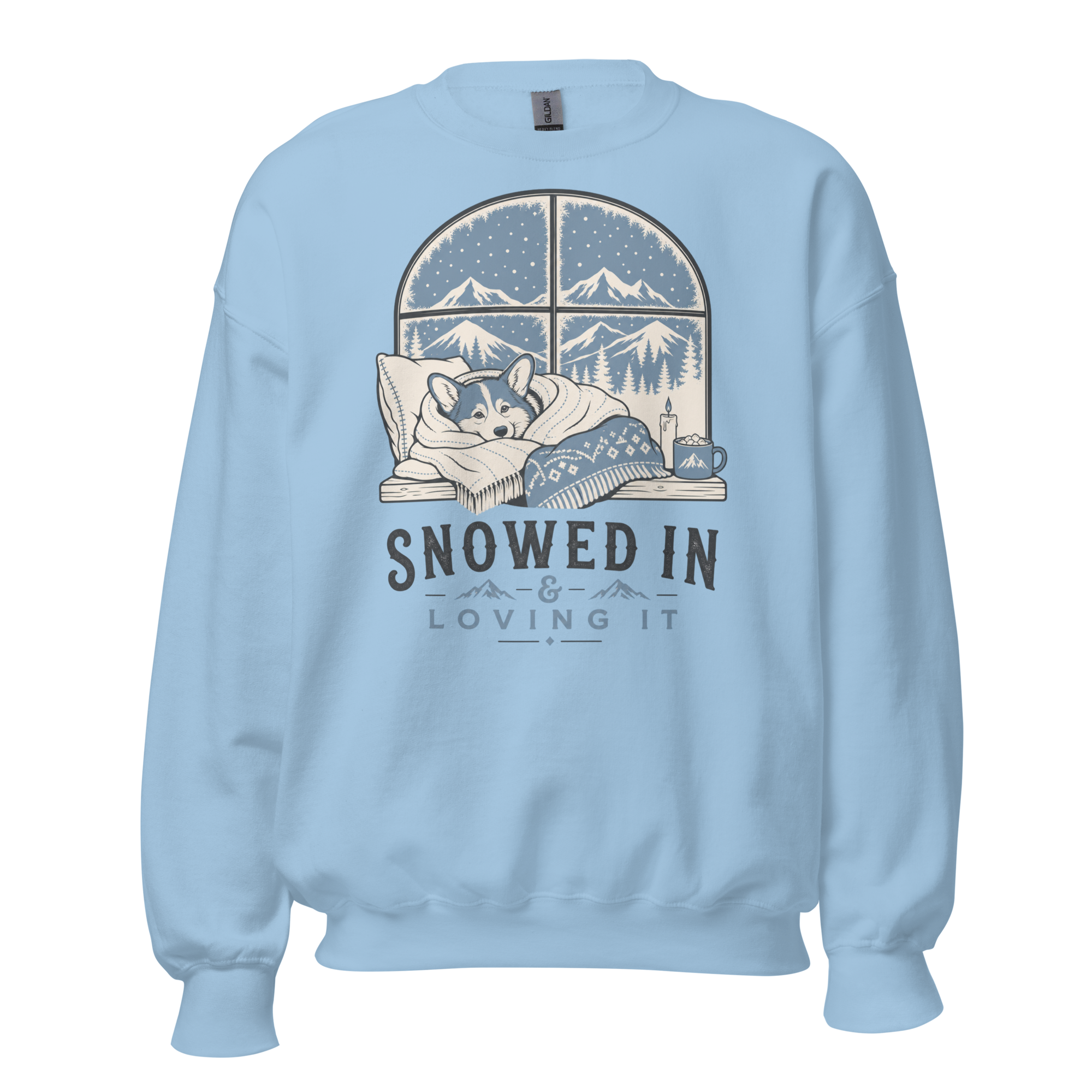 Light blue sweatshirt with a graphic of a dog by a window and 'Snowed In Loving It' text on a white background.