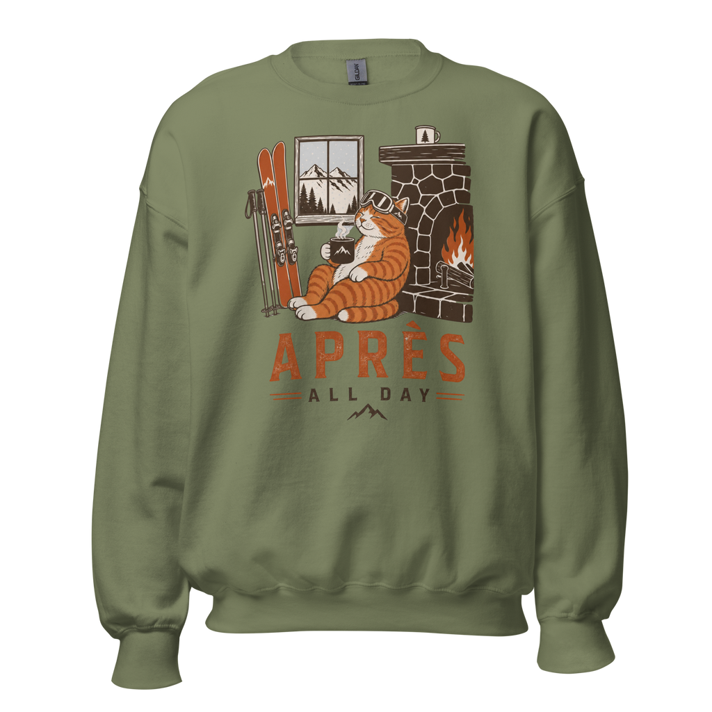 Military green sweatshirt with a cat by a fireplace graphic and 'APRES ALL DAY' text