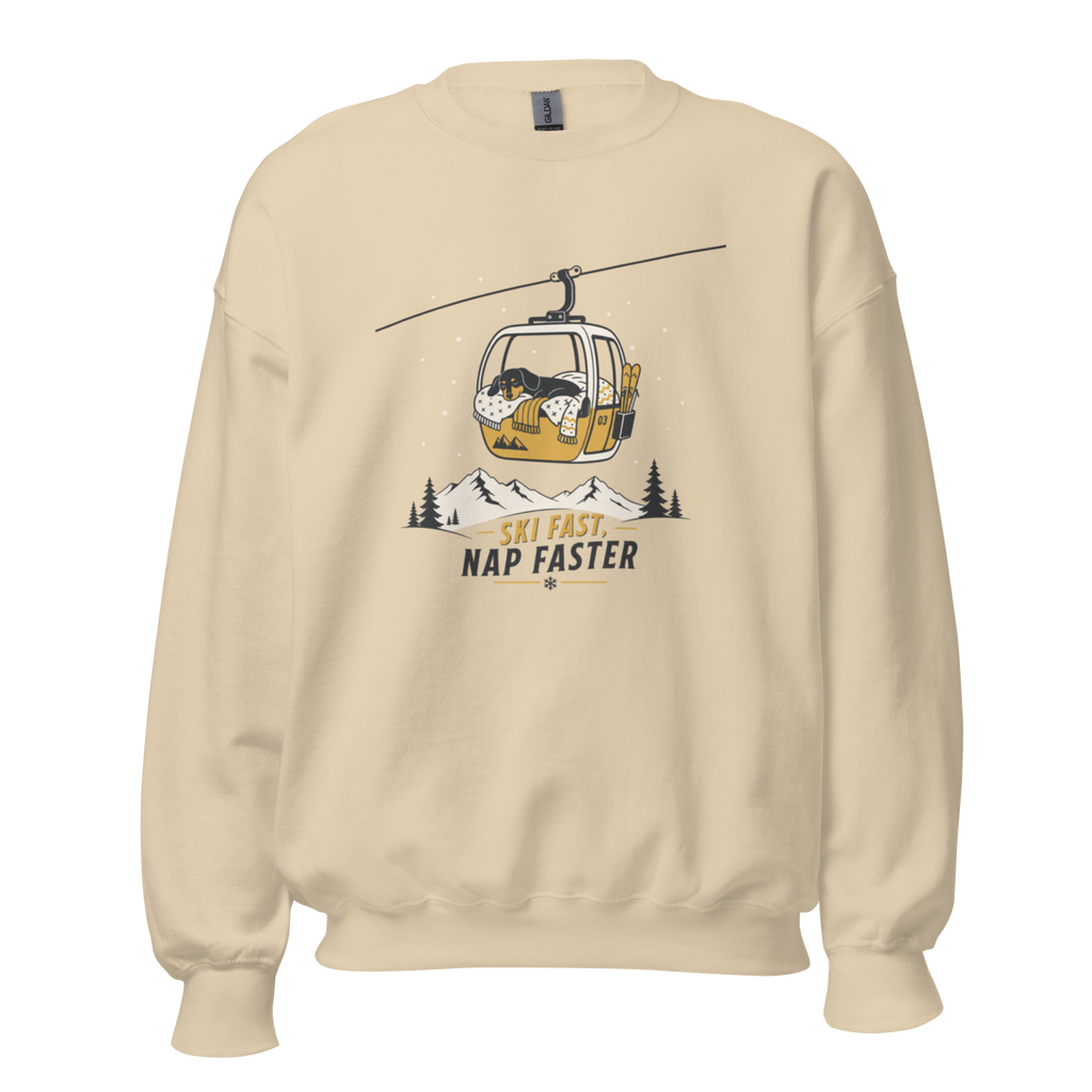 Sand colored sweatshirt with a graphic of a gondola lift and text 'Ski Fast, Nap Faster' on a white background