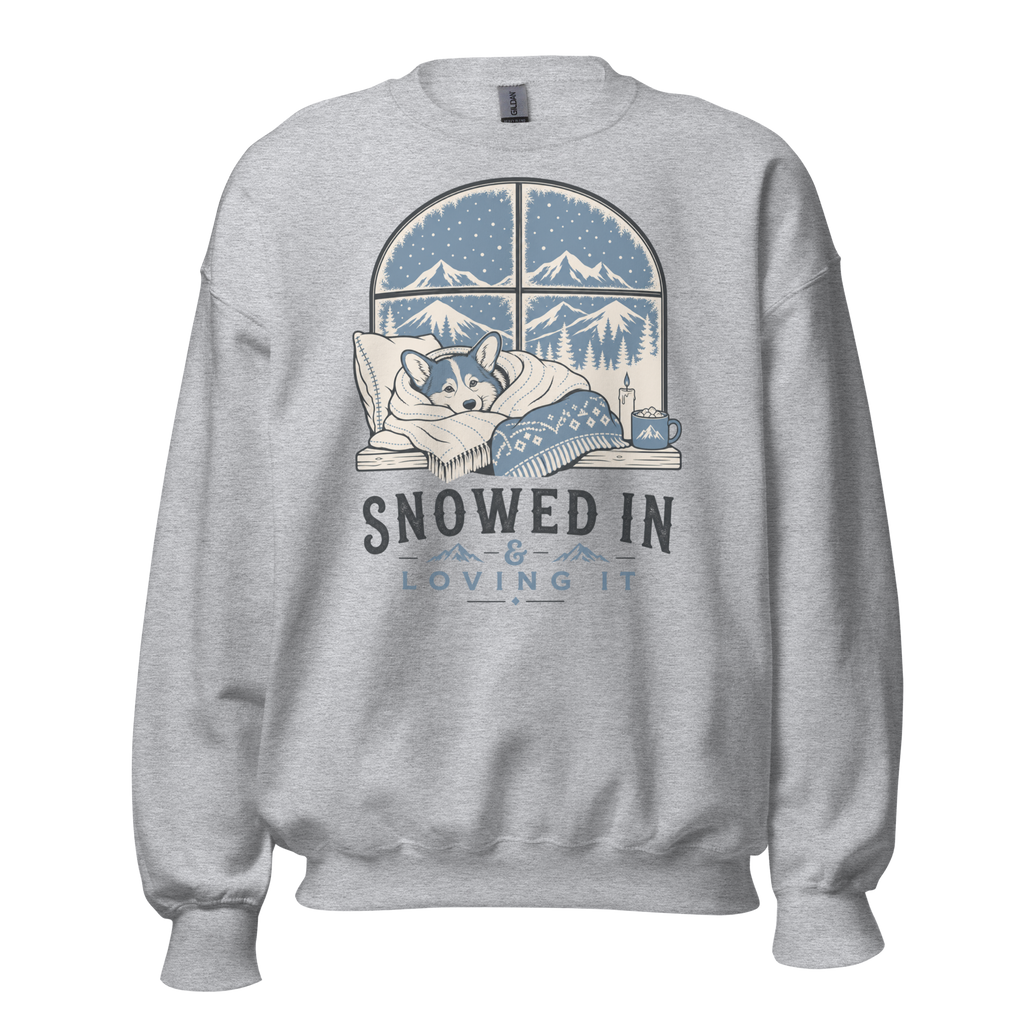 Sport gray sweatshirt with a graphic of a dog by a window and 'Snowed In, Loving It' text on a white background