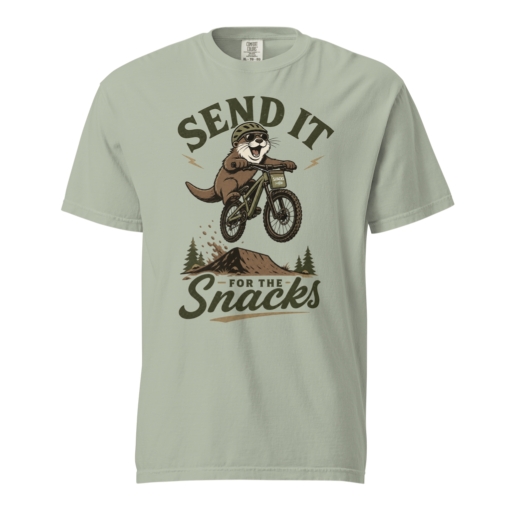 Bay green t-shirt with an otter riding a bike graphic and text 'Send it for the snacks'.