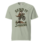 Bay green t-shirt with an otter riding a bike graphic and text 'Send it for the snacks'.