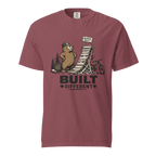 Brick red t-shirt with beaver graphic and 'Built Different' text on a white background