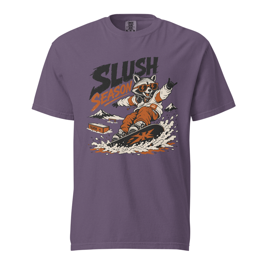 Purple t-shirt with a graphic of a raccoon snowboarding and 'Slush Season' text on a white background
