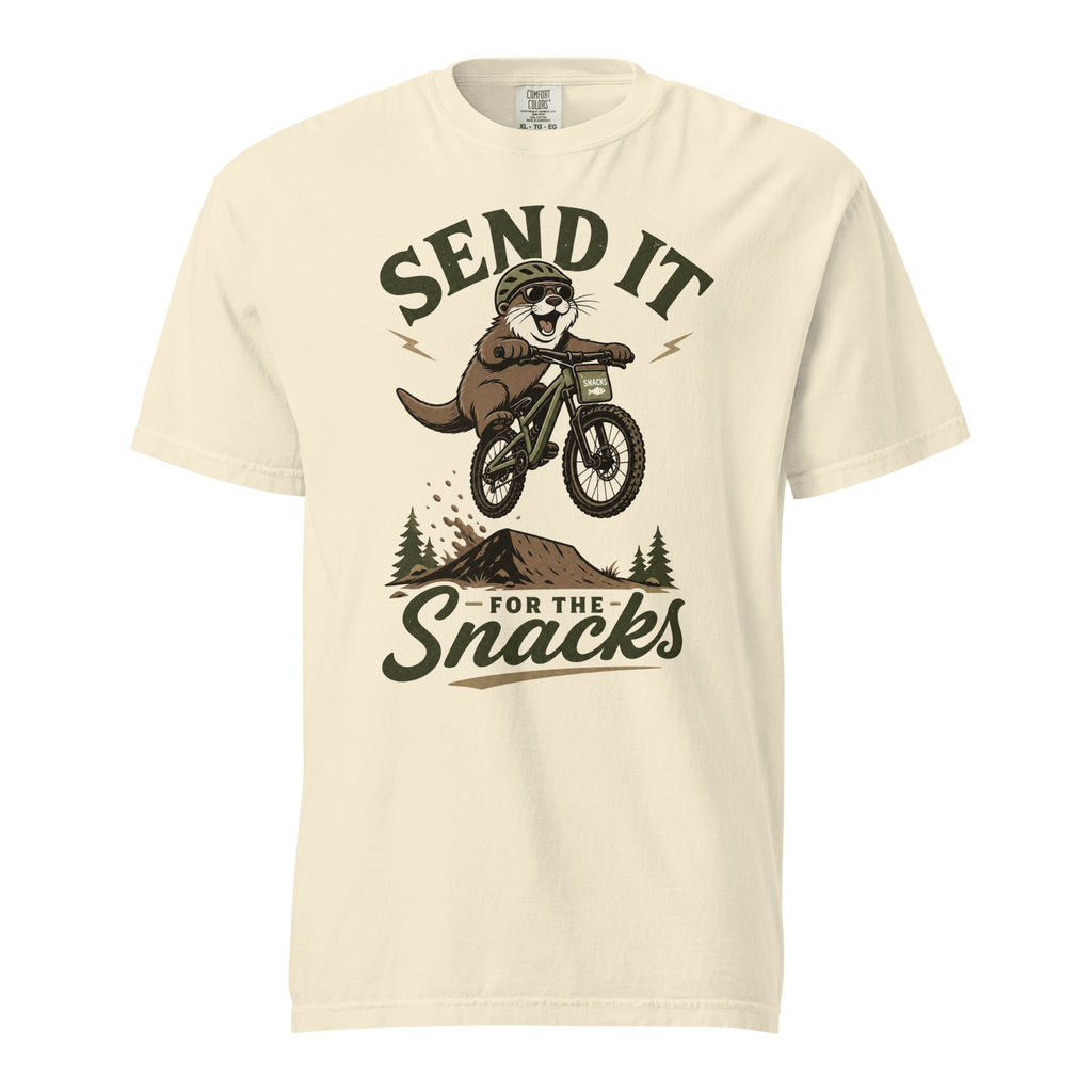 Ivory white t-shirt with graphic of an otter on a bike and text 'Send it for the snacks'.