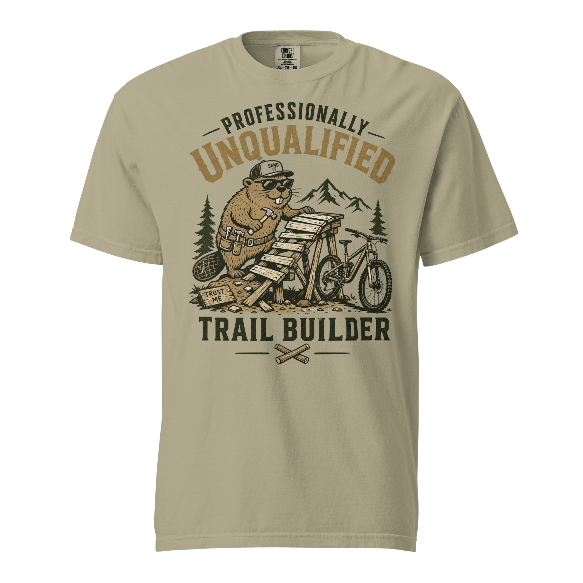 Beige t-shirt with graphic design of a beaver on a motorcycle and text 'Professionally Unqualified Trail Builder' on a white background.