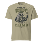 Khaki colored t-shirt with a graphic of a raccoon riding a bike and text 'Born to Ride, Forced to Climb'.