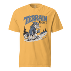 Mustard yellow t-shirt with a graphic of a skier and 'Terrain Addict' text on a white background