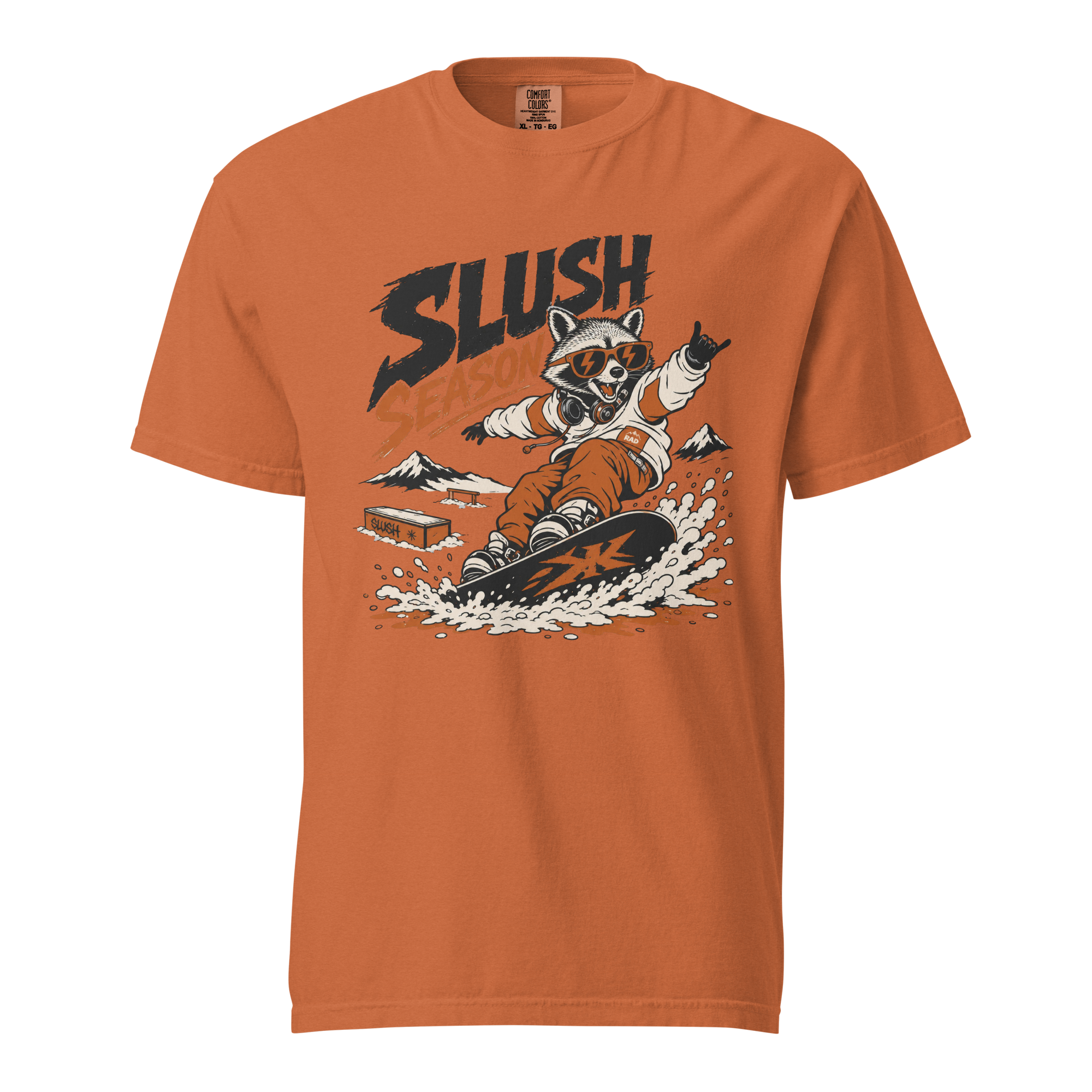 Yam colored t-shirt with a graphic of a raccoon snowboarding and the word 'SLUSH' on a white background.